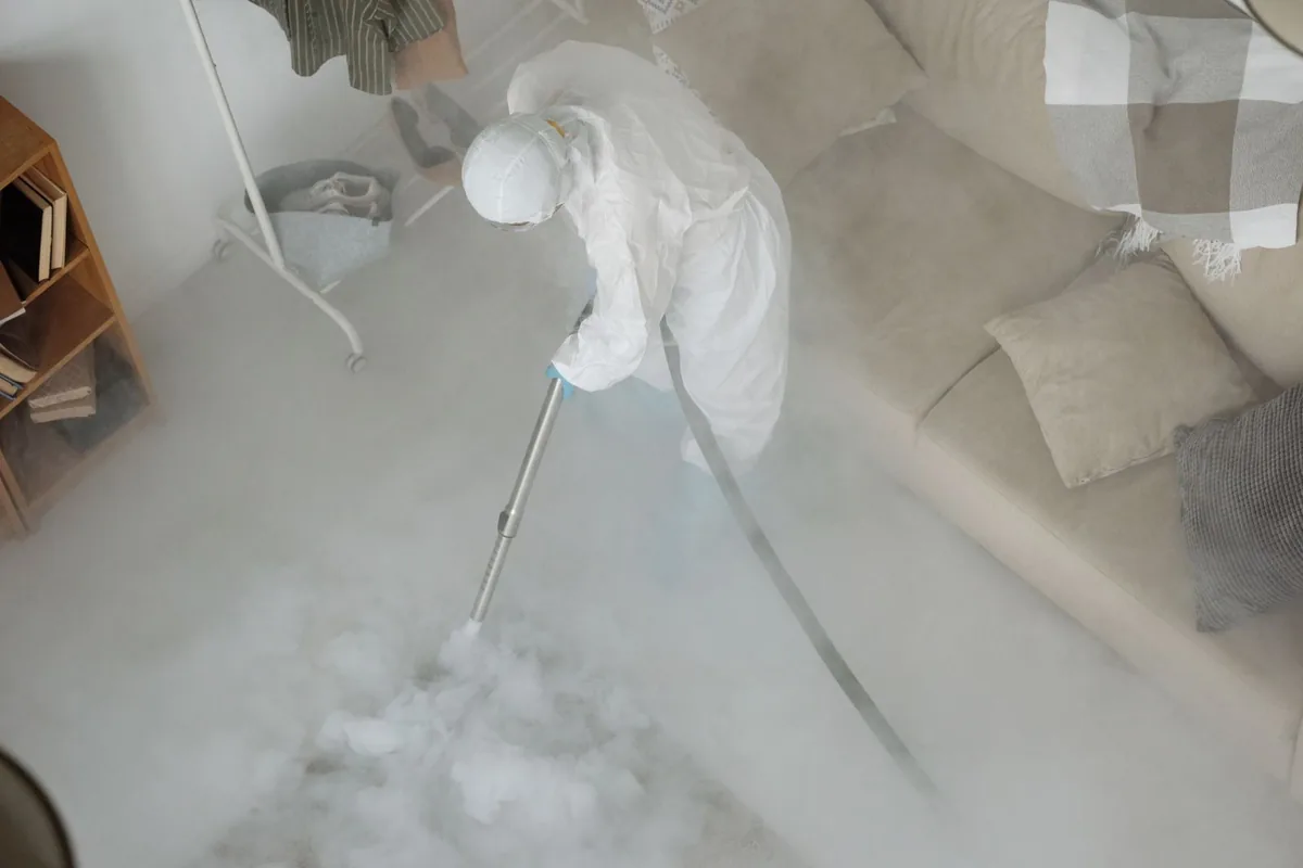 Biohazard cleanup technician in protective equipment, Horseshoe Bay, TX